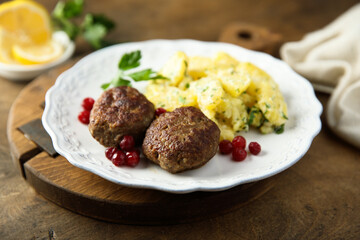 Homemade meatballs with cranberry and potato salad