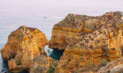 Panoramic view of Ponta da Piedade, Lagos in Algarve, Portugal   Cliffs, rocks and tourist boats at sea