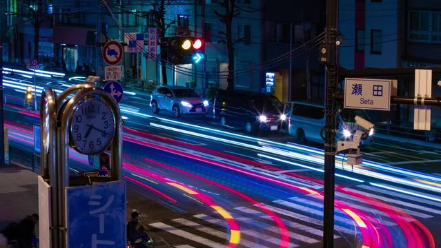 A night timelapse of the traffic jam at the city street in Tokyo zoom