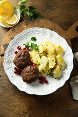 Homemade meatballs with cranberry and potato salad