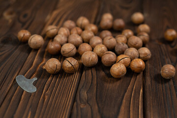 Macadamia nut close-up on brown wood background