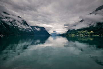 fjord of norway and mountains on a summer rainy day