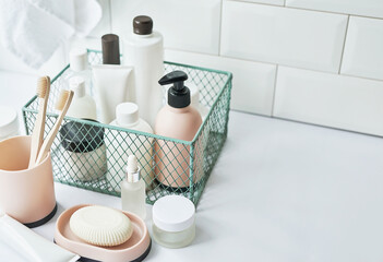 Fototapeta na wymiar Bath accessories. Dressing table. Cosmetics and hygiene products. Spa and beauty salon. Toothbrush and soap, cream containers