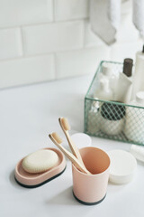 Fototapeta na wymiar Bath accessories. Dressing table. Cosmetics and hygiene products. Spa and beauty salon. Toothbrush and soap, cream containers