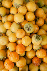 ripe persimmon lies on the counter, top view
