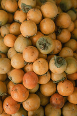 ripe persimmon lies on the counter, top view