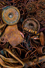 Fototapeta na wymiar A pile of copper scrap for recycling. Copper is mainly heat pipes and heat exchangers from laptop cooling systems.