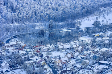Snowy village with church from above
