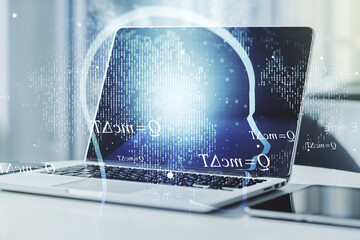 Creative artificial Intelligence concept with human head hologram on modern laptop background. Multiexposure