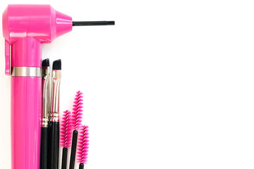 Obraz premium mixer for mixing paint and brushes on a white background. The concept of coloring eyebrows and eyelashes, eyebrow master