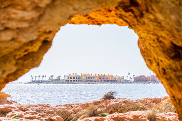 Beautiful sandstone arch with the view on marina in Portimao, Ferragudo, Algarve, Portugal