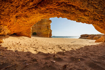 Beautiful sandstone arch with the view on the Atlantic Ocean in Ferragudo, Algarve, Portugal