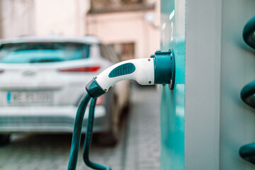 Electric car fast power station with electricity charging battery tiny. High quality photo