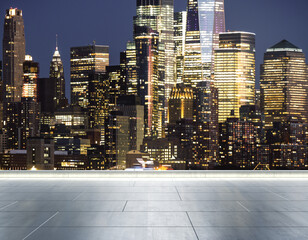 Empty concrete rooftop on the background of a beautiful blurry Manhattan skyline at twilight, mockup