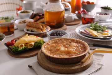 Many different dishes served on buffet table for brunch