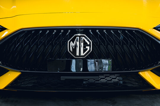 Close up MG logo car with the front grille of yeoolw MG car at Robinson Lifestyle Roi Et mall.