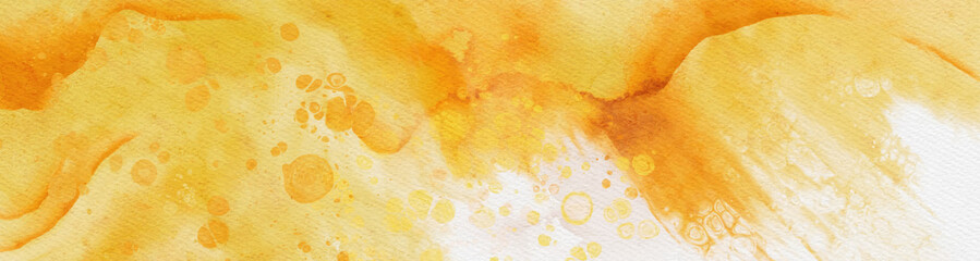 Abstract gold and yellow watercolor paint background.
