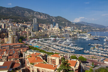 Panoramic aerial view of Monaco and Port Hercule, sweeping views of the city, mountains and harbor, luxury yachts and apartments in La Condamine district, city centre Monte Carlo, Monaco,Cote d'Azur