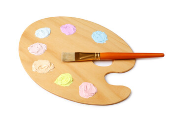 Wooden artist's palette with samples of pastel paints and brush isolated on white