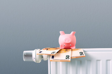  piggy bank and money on radiator, rise in heating costs