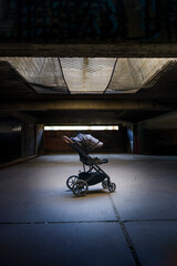 Kids strollers in a dirty old shelter-civilian casualties concept