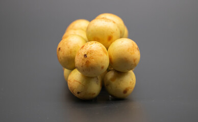 closeup of the growing sweet and delicious  Baccaurea motleyana fruits on the tree, group of Baccaurea motleyana