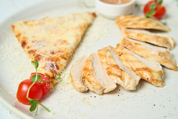 Grilled chicken breasts and vegetables