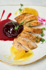 Grilled chicken breasts and vegetables