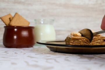 Sweet milk cake on white background with milk and cookies