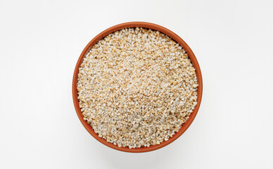 Barley groats in bowls and bags isolated on a white background. High quality photo - obrazy, fototapety, plakaty