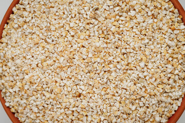 Barley groats texture background. High quality photo