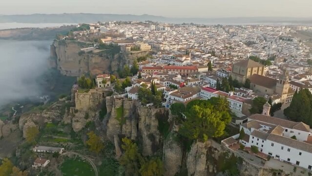  Aerial view of Ronda, Andalusia, Spain. Flying over Ronda on a foggy morning. UHD, 4K