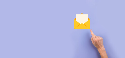 Businessman hand holding letter icon,email icons.Contact us by newsletter email and protect your...