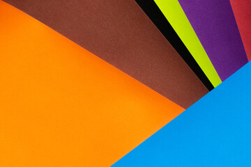 abstract geometric background with multicolored paper stripes.