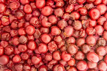 Fermented cherries for the preparation of fruit distillate spirit drink.