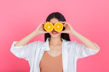 asian young pretty woman happy smile with orange fruit Vitamin C, beauty clean fresh skin, face care, facial treatment, lifestyle and healthy food concept.