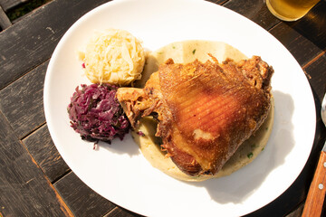 oktoberfest - eisbein german food in daylight, pork, sauerkraut  top view