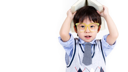 little boy wearing glasses with books on white background, education concept.