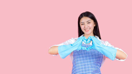 Obraz premium Portrait asian beautiful woman wearing apron and rubber gloves for cleaning , Housekeeper standing with products and equipment cleaner.
