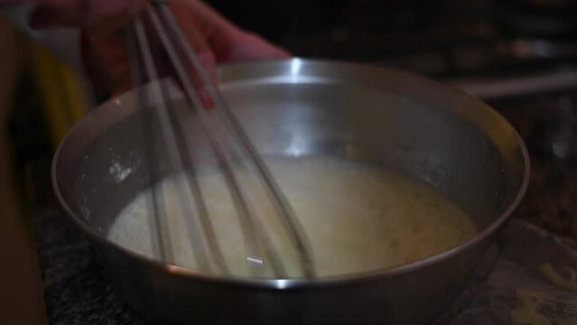 manual wire mixer with bouls in slow motion