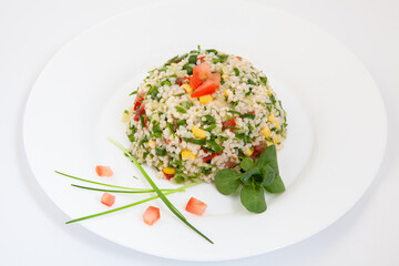 White rice mixed with colorful vegetables. Rice and vegetables in plate