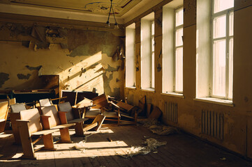 Hall in an abandoned building, dirt, dust and debris, broken furniture, sunlight breaking through dusty windows, a feeling of sadness and trouble