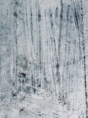 an irregular whitewashed gray wall