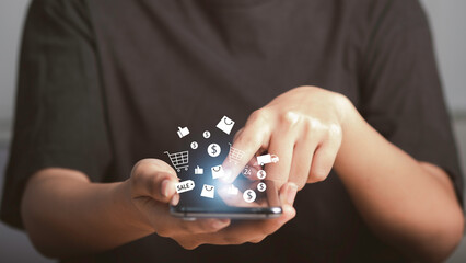 Shopping online concept, e-commerce, internet banking, spending money concept. Business man hold credit card and using smartphone with cart, discounted price, delivery, 24 hours service icon.