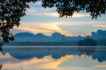 Ban Nong Thale, Krabi province, Thailand. Beautiful natural reflection on water before sunrise.