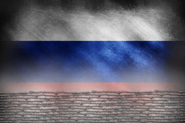 The Russian flag behind barbed wire on a grunge background