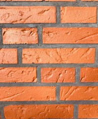 Fototapeta premium a reddish brown brick wall as background