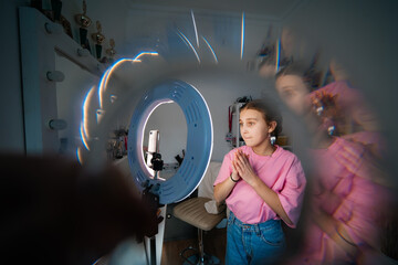 girl teenager records video uses smartphone