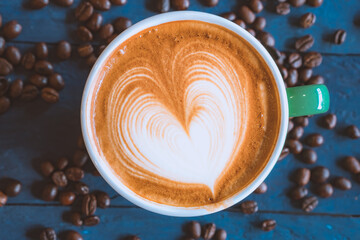 coffee latte art on wood table, relax time, cafe barista art top view.