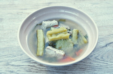 boiled bitter cucumber with pork bone in clear soup on bowl